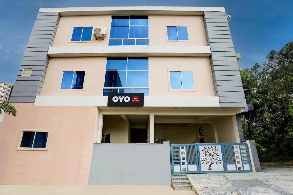 aominium building with a qo sign on it at Hotel O Grand Embassy in Mānglia