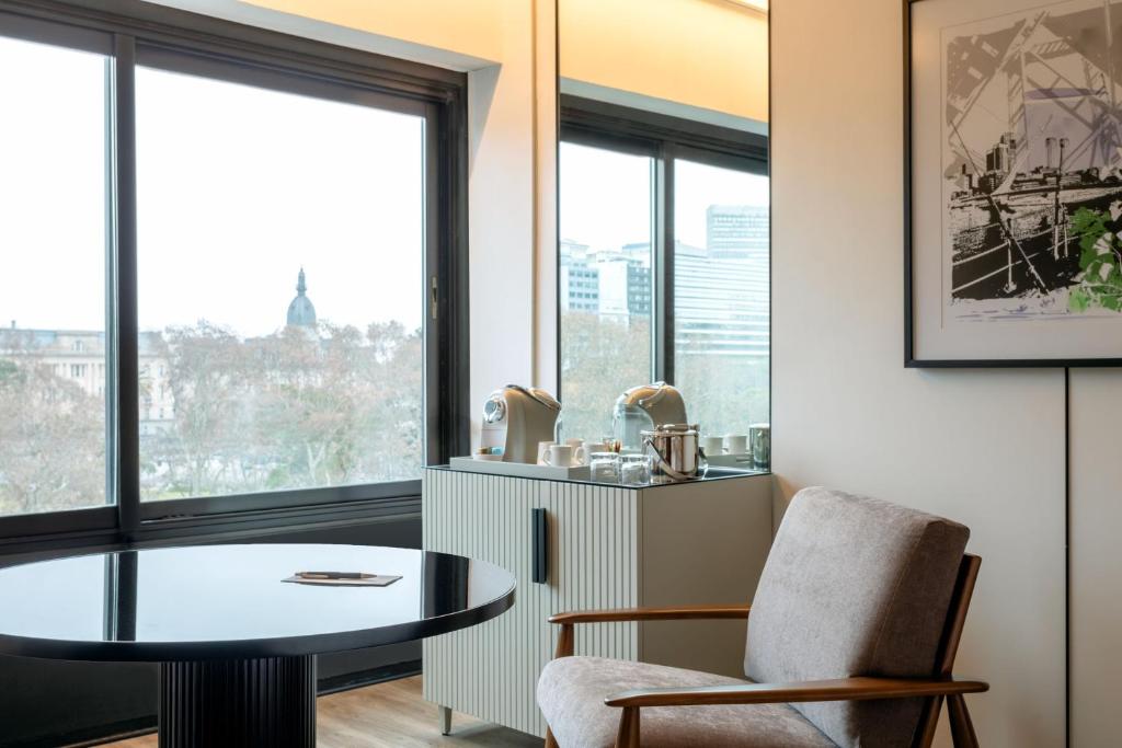 a room with a table and a chair and a window at Sheraton Buenos Aires Hotel & Convention Center in Buenos Aires
