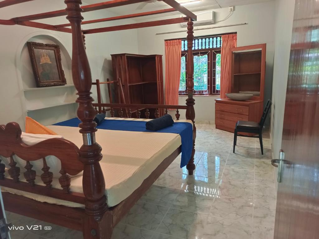 Postel nebo postele na pokoji v ubytování Emerald Villas Weligama