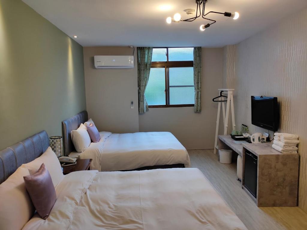 Postel nebo postele na pokoji v ubytování Sun Moon Lake Loft Inn