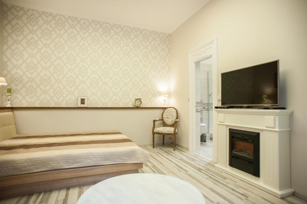 Televízia a/alebo spoločenská miestnosť v ubytovaní All In Apartman II.