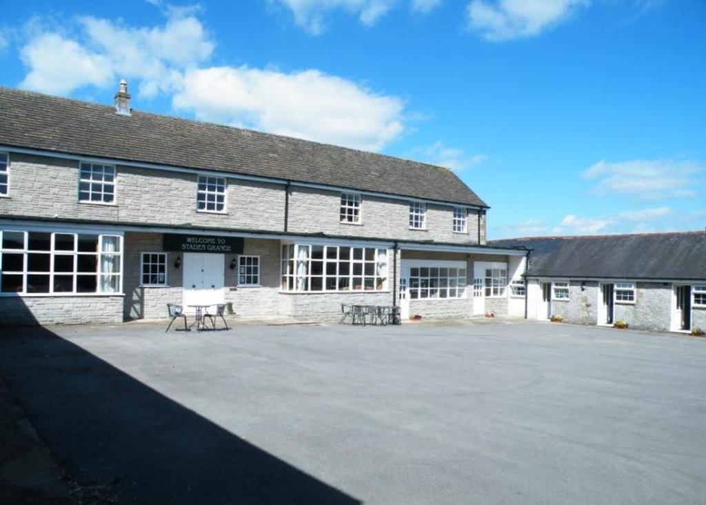 a large building with a large parking lot in front of it at Staden Grange in Buxton