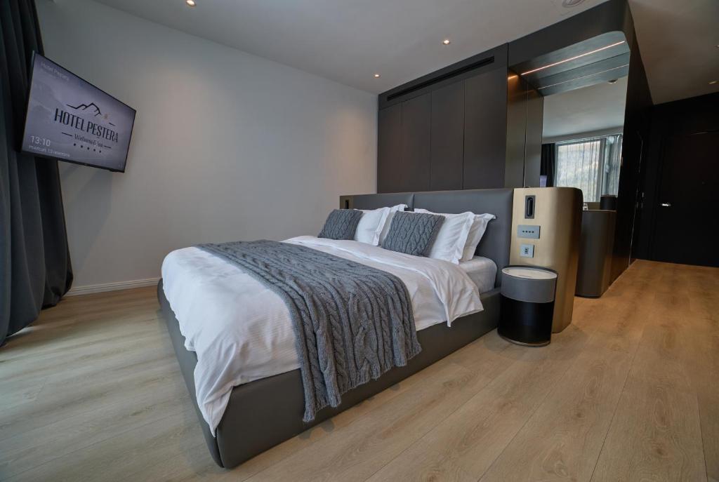 Postel nebo postele na pokoji v ubytování Hotel Pestera Wellness & Spa