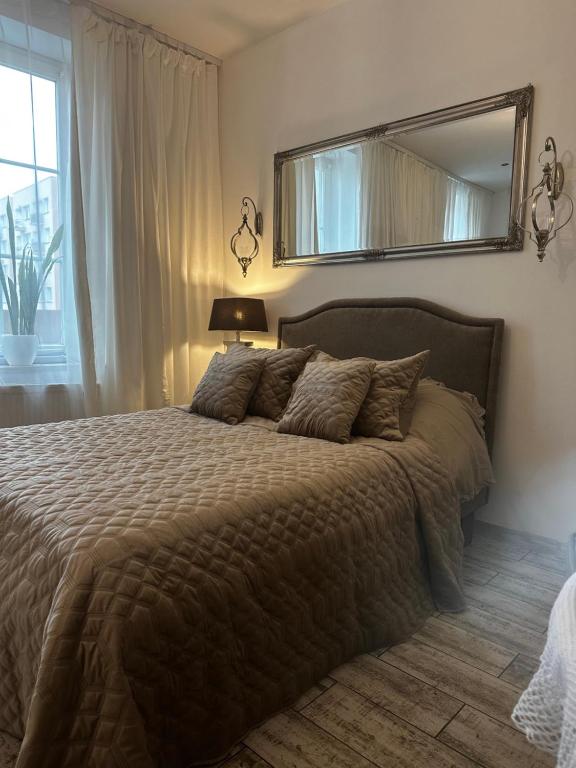 Posteľ alebo postele v izbe v ubytovaní Apartamencik Królewiecka