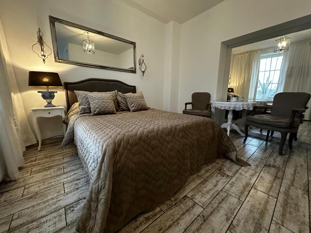 Posteľ alebo postele v izbe v ubytovaní Apartamencik Królewiecka