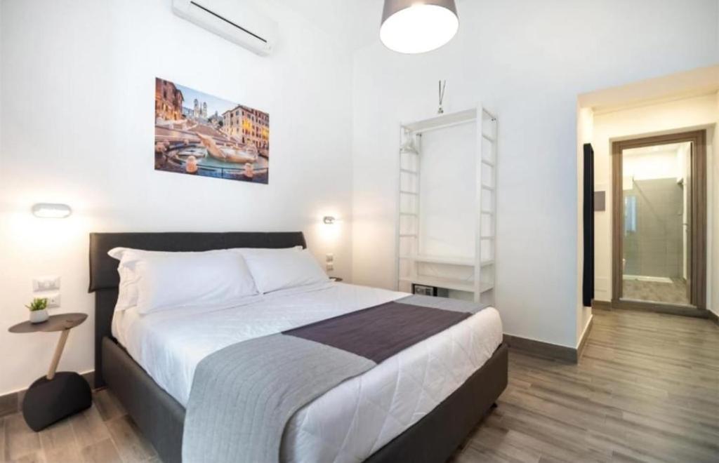 A bed or beds in a room at Clementi 18 Suites Rome