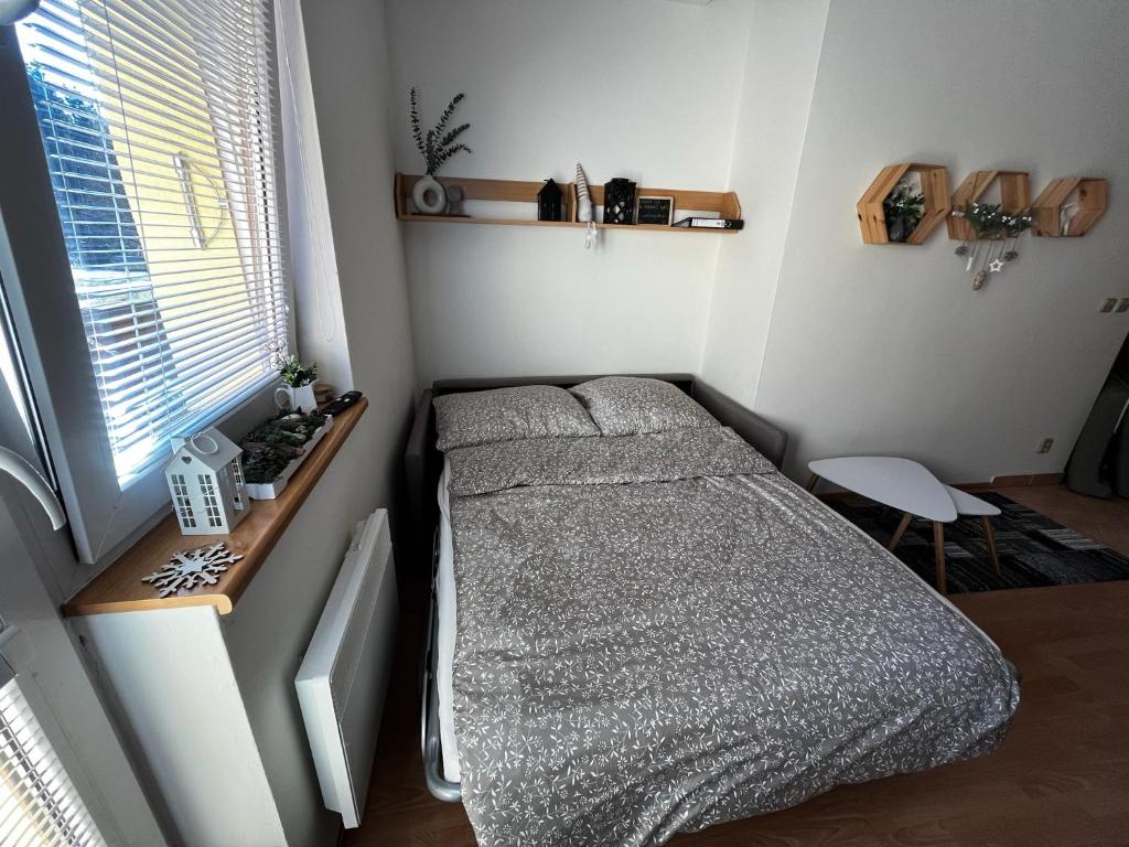 A bed or beds in a room at Apartmán pod Hoľou, Tatran-Donovaly