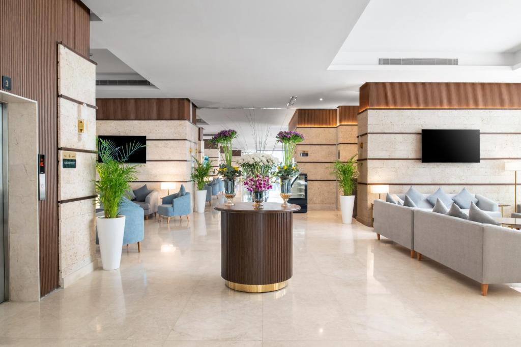 TV a/nebo společenská místnost v ubytování Elaf Qinwan Hotel