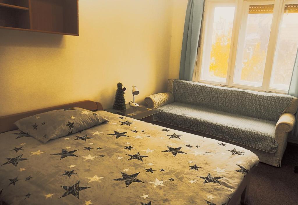 Postel nebo postele na pokoji v ubytování Ryder Apartment