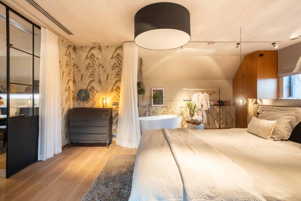 Postel nebo postele na pokoji v ubytování vakantieverblijf Pand19