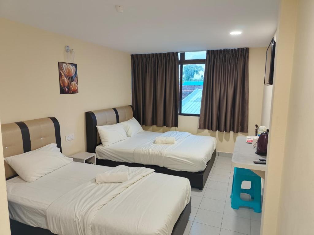 Postel nebo postele na pokoji v ubytování Southern Tip Hotel