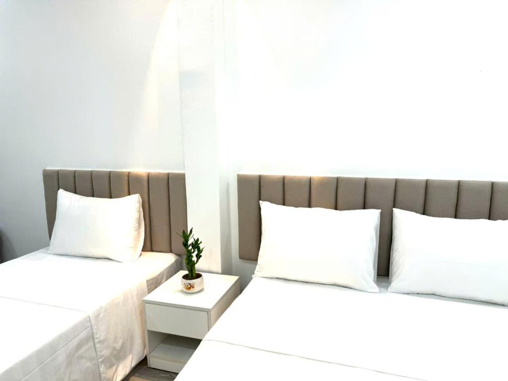 Postel nebo postele na pokoji v ubytování The Queen Hotel & Spa 2