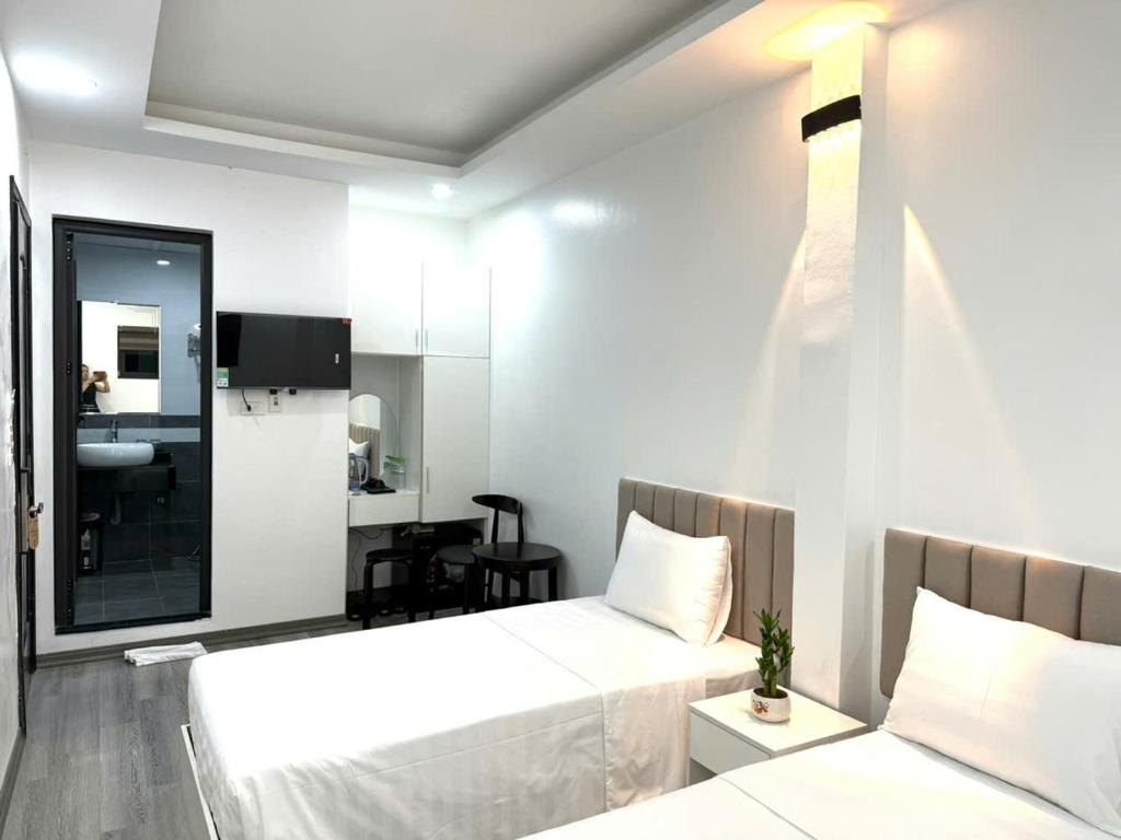 Postel nebo postele na pokoji v ubytování The Queen Hotel & Spa 2
