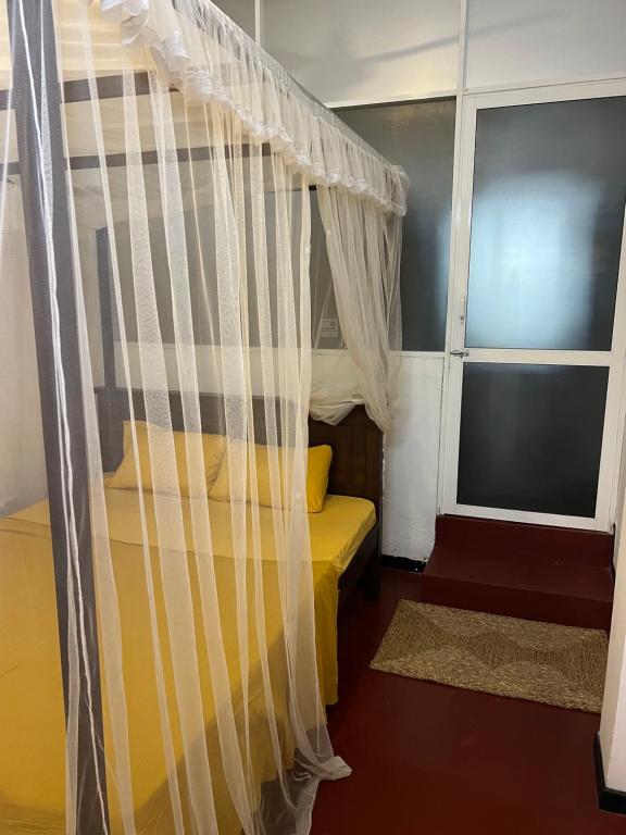 Postel nebo postele na pokoji v ubytování Hari Hari Hostel