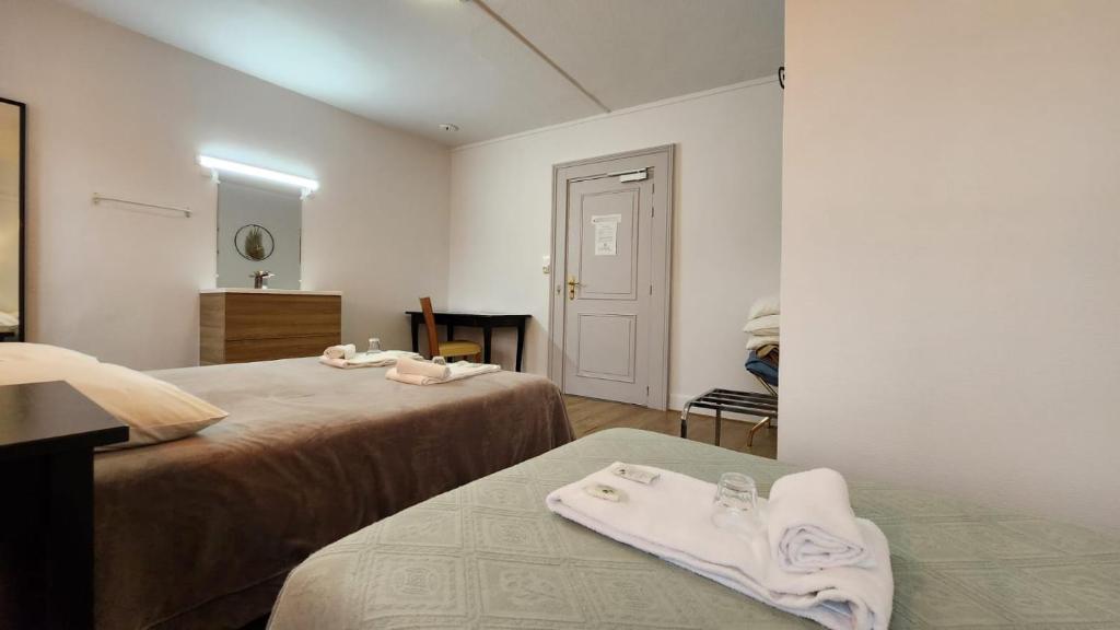 Postel nebo postele na pokoji v ubytování Hôtel Patricia - Strasbourg Hyper Centre