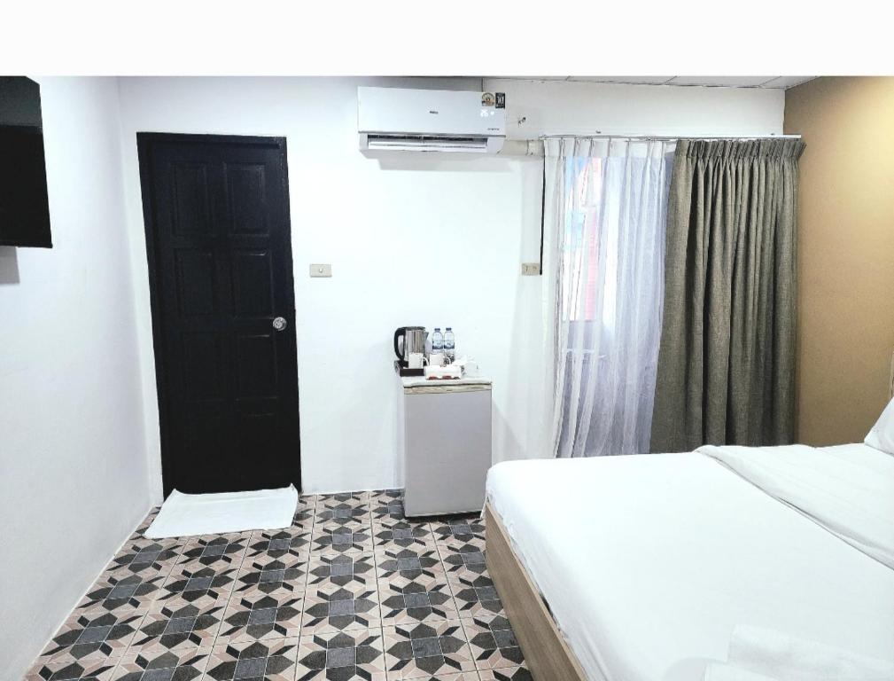 Postel nebo postele na pokoji v ubytování Burning flame Hotel