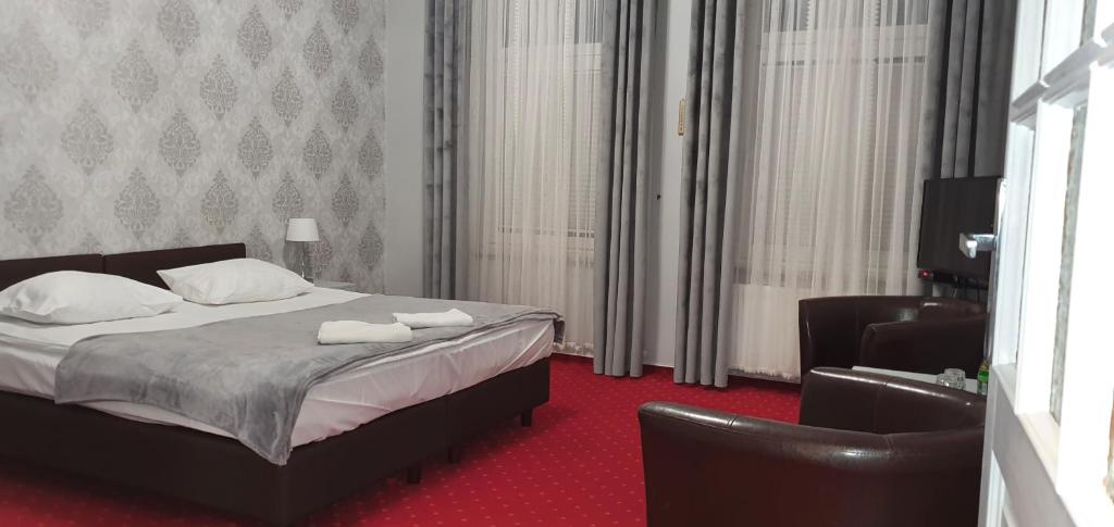 Posteľ alebo postele v izbe v ubytovaní Hotel Nad Rzeczką