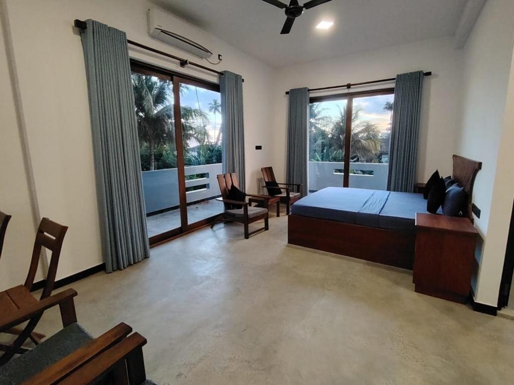 Postel nebo postele na pokoji v ubytování Banyan Scape Villa