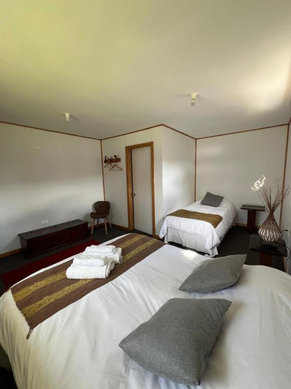 Postel nebo postele na pokoji v ubytování Hostal Amerindia
