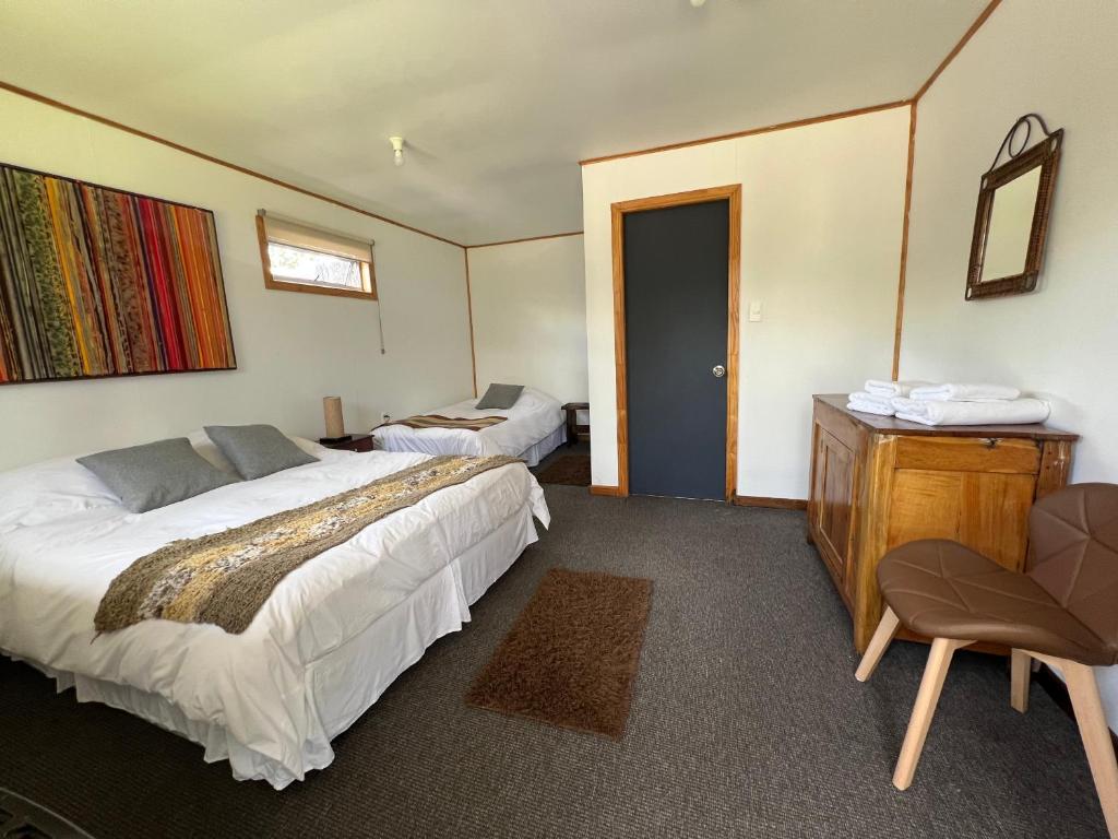 Postel nebo postele na pokoji v ubytování Hostal Amerindia