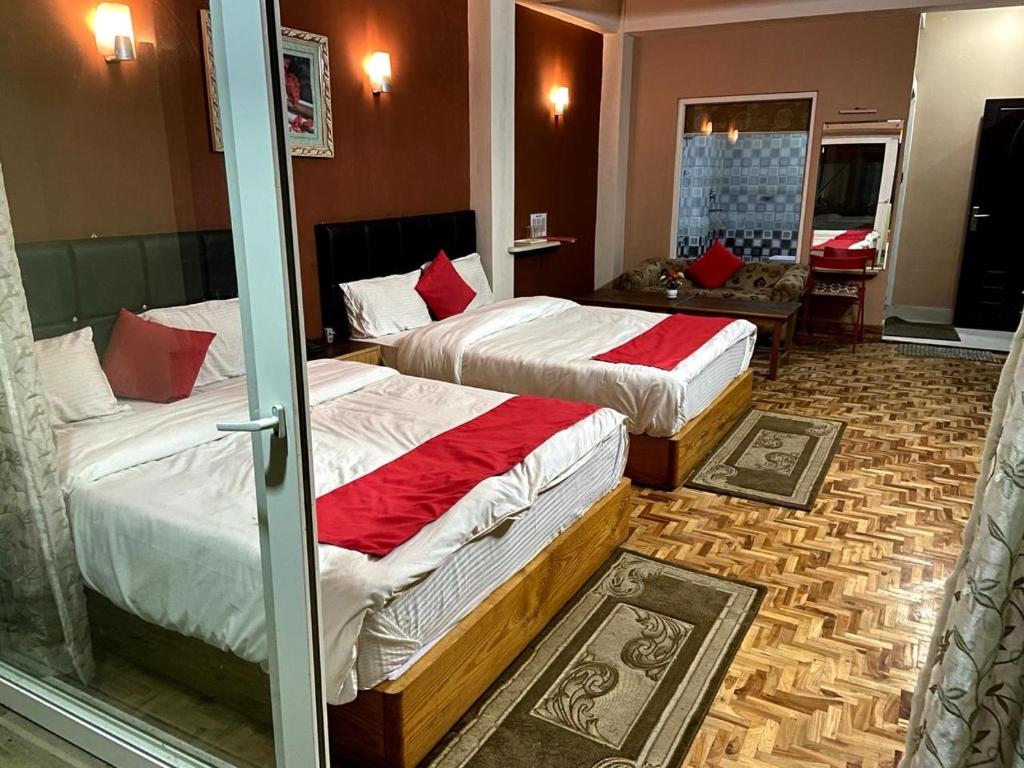 Postel nebo postele na pokoji v ubytování Hidden Gem Residency