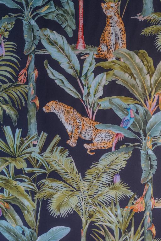 a wallpaper with jaguars in the jungle at Kyriad Cannes - Mandelieu in Cannes