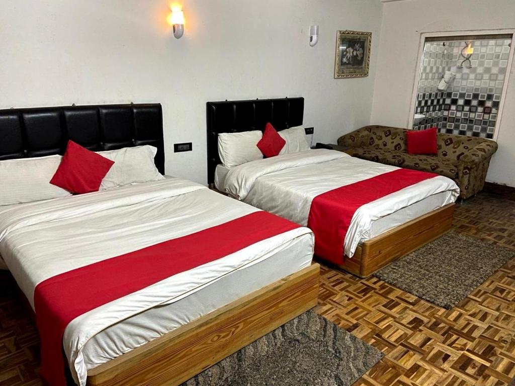 Postel nebo postele na pokoji v ubytování Hidden Gem Residency
