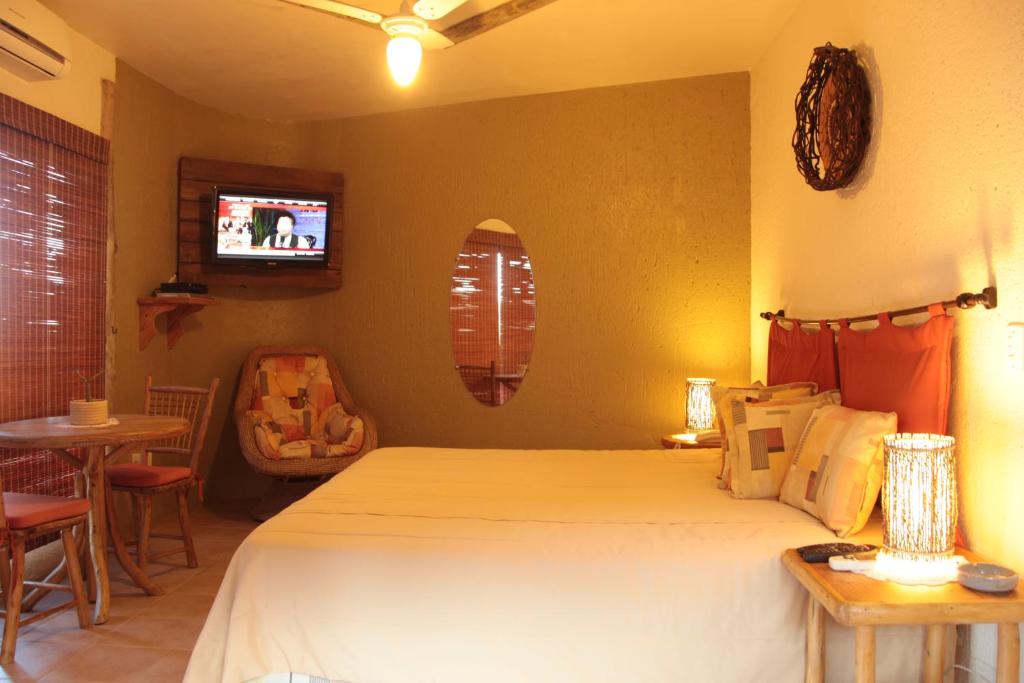 Postel nebo postele na pokoji v ubytování Bangalore Suites