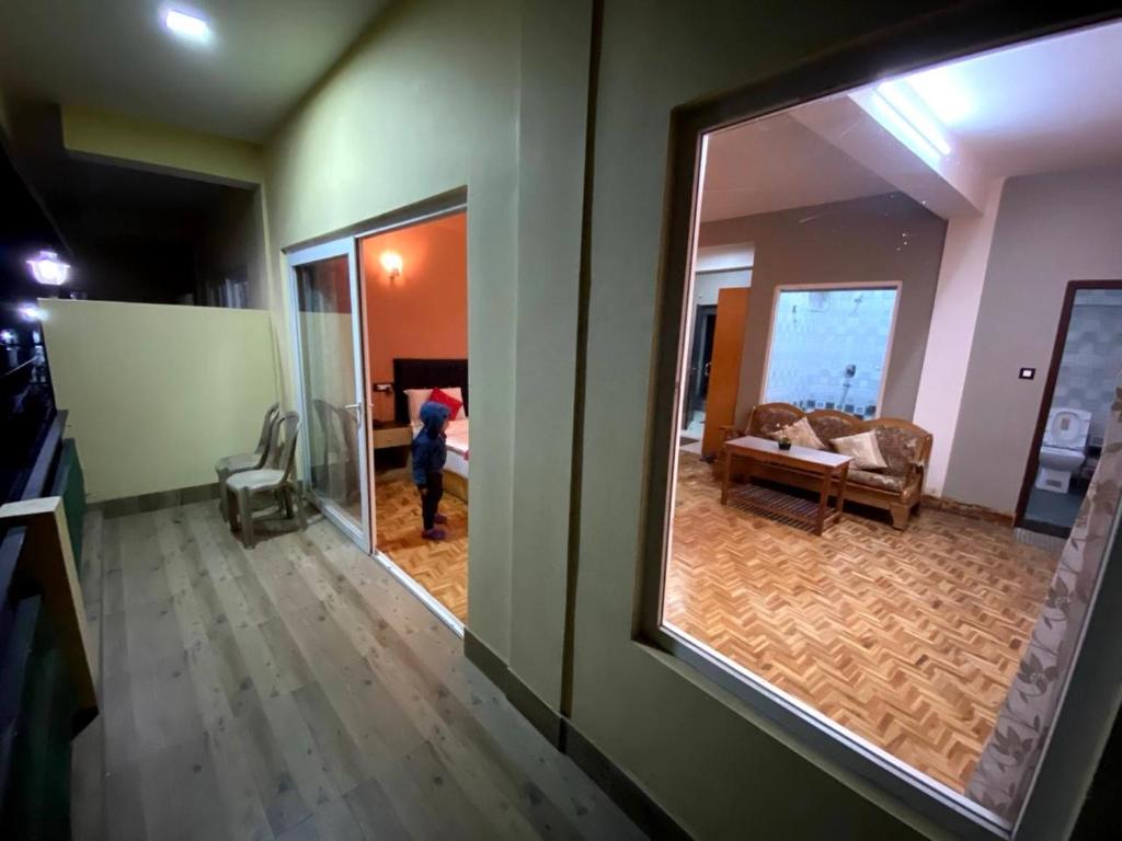Postel nebo postele na pokoji v ubytování Hidden Gem Residency