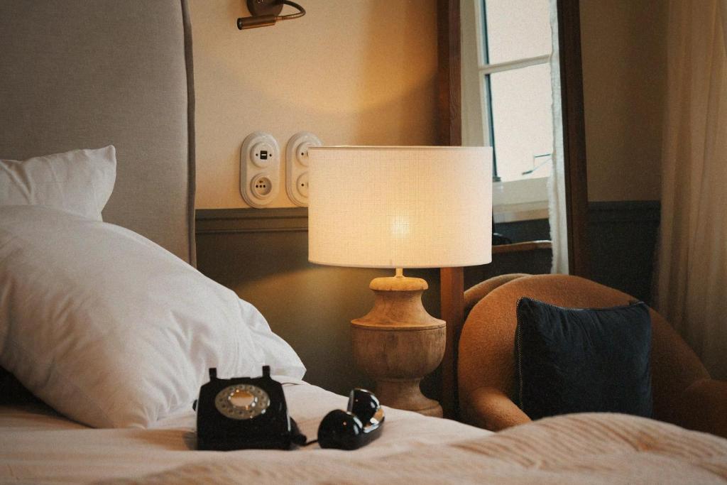 Postel nebo postele na pokoji v ubytování Boutique Hotel SOCLO