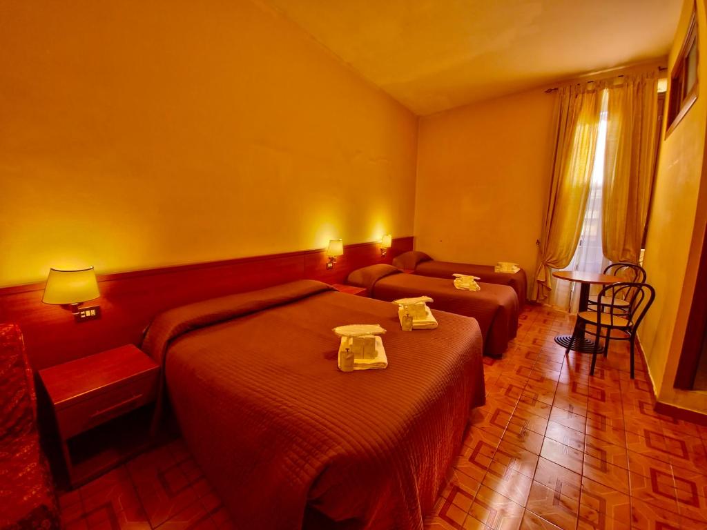 Postel nebo postele na pokoji v ubytování Hotel Azzurra