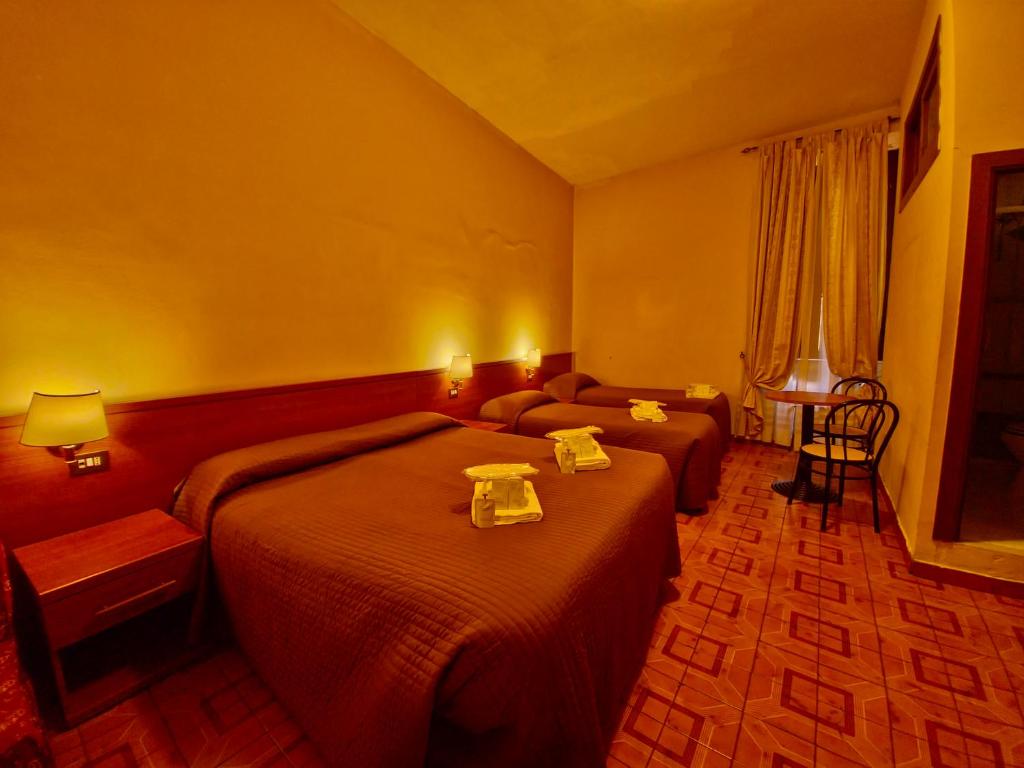 Postel nebo postele na pokoji v ubytování Hotel Azzurra
