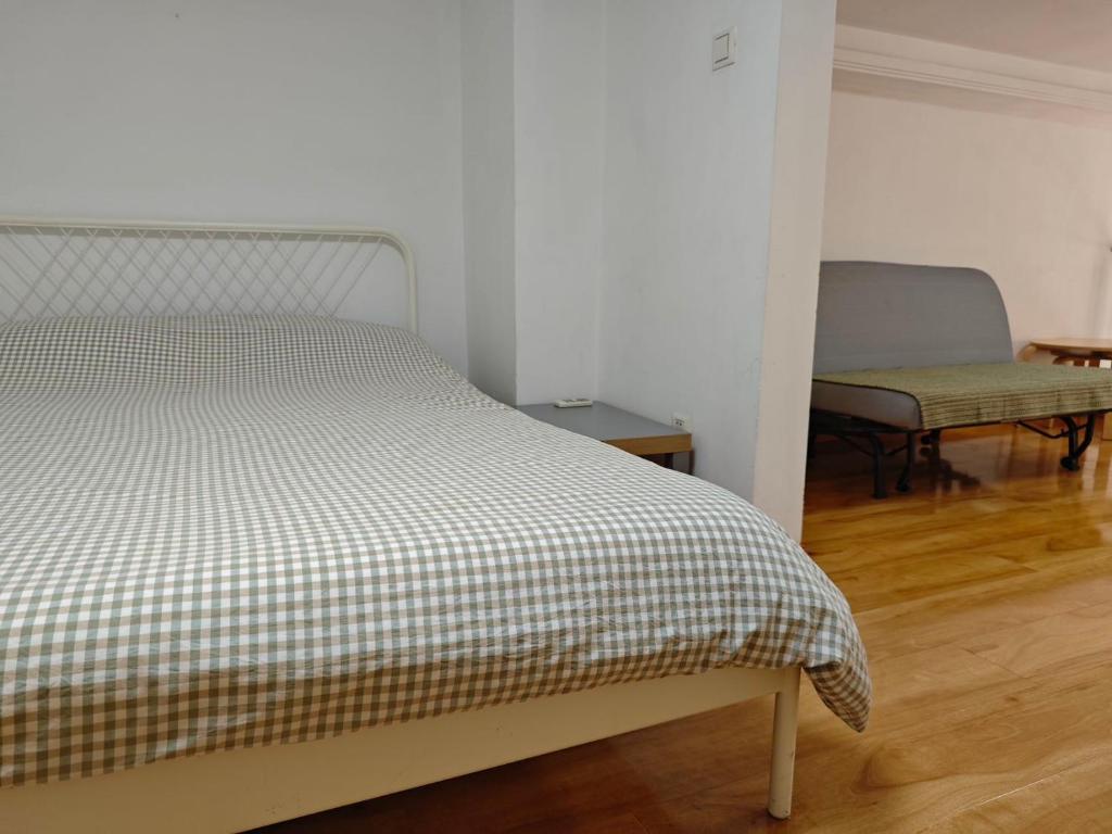 Postel nebo postele na pokoji v ubytování iNestin Shanghai Apt Xinjinqiao Road