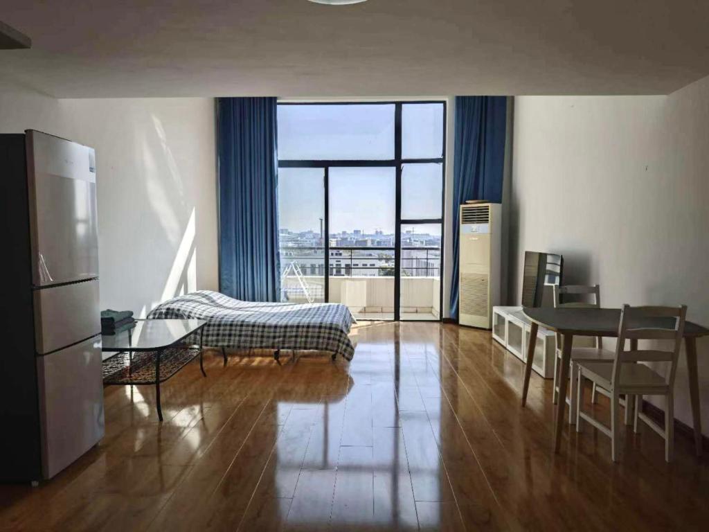 Kuchyň nebo kuchyňský kout v ubytování iNestin Shanghai Apt Xinjinqiao Road