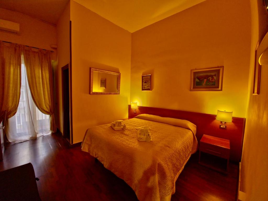 Postel nebo postele na pokoji v ubytování Hotel Azzurra