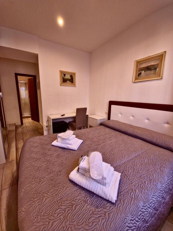 Postel nebo postele na pokoji v ubytování Hotel Azzurra
