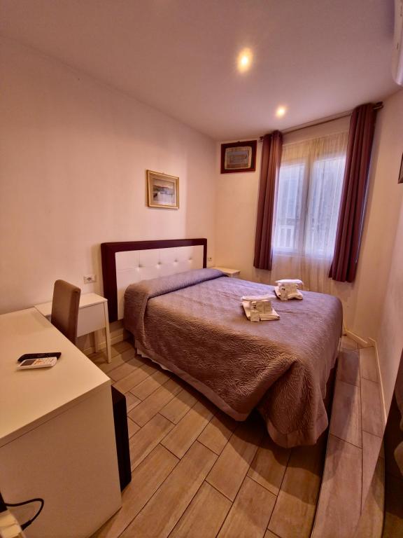 Postel nebo postele na pokoji v ubytování Hotel Azzurra