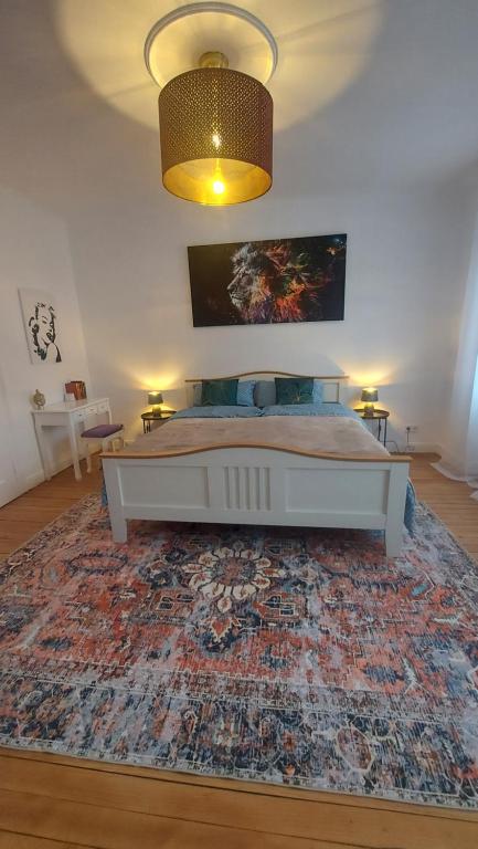 a bedroom with a bed with a large rug at Wohlfühl Landhaus in Habkirchen