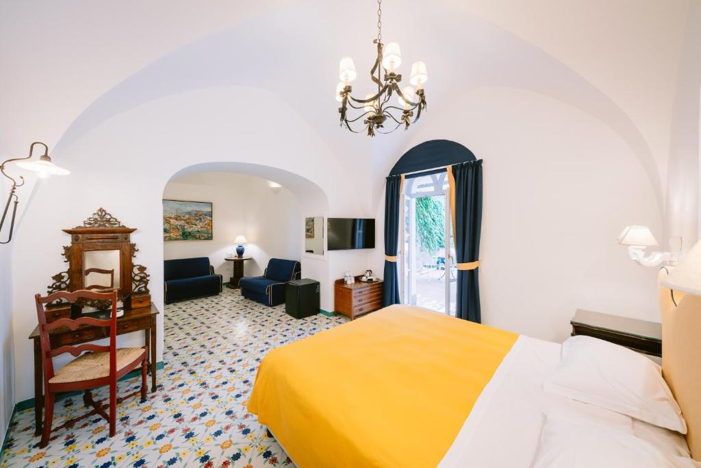 Postel nebo postele na pokoji v ubytování Hotel Giordano