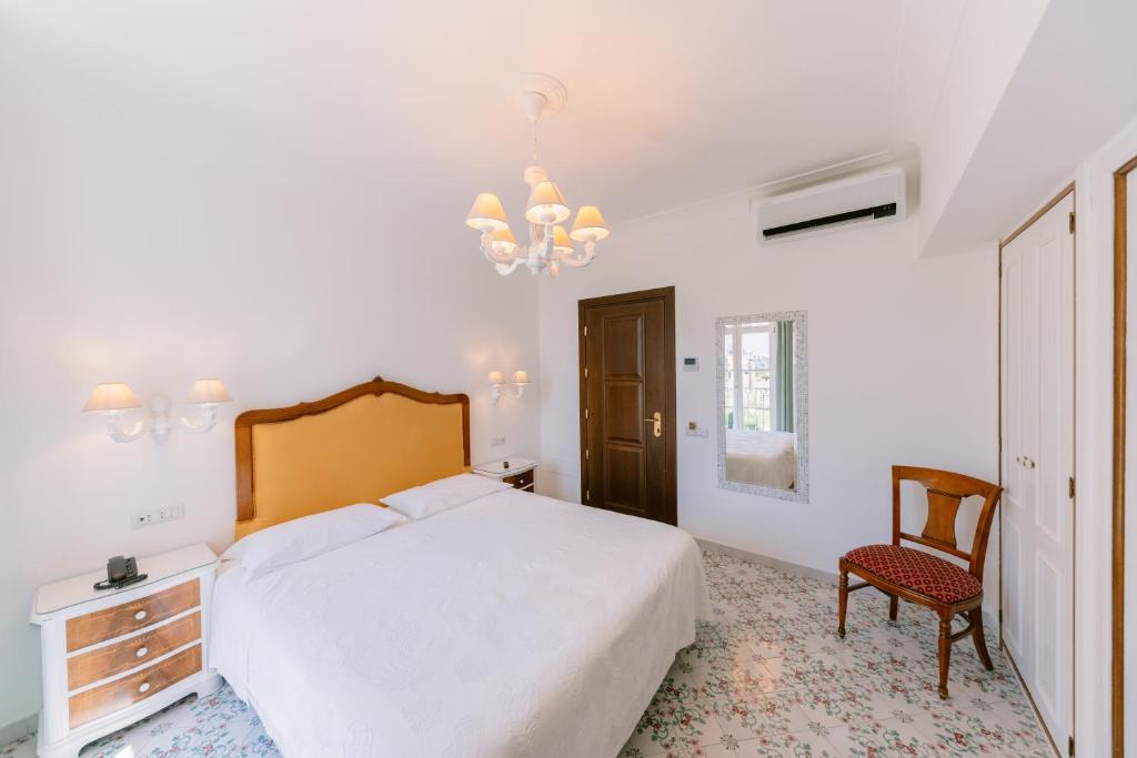 Postel nebo postele na pokoji v ubytování Hotel Giordano