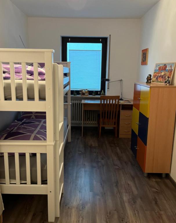 Postel nebo postele na pokoji v ubytování Ferienwohnung in der fränkischen Schweiz
