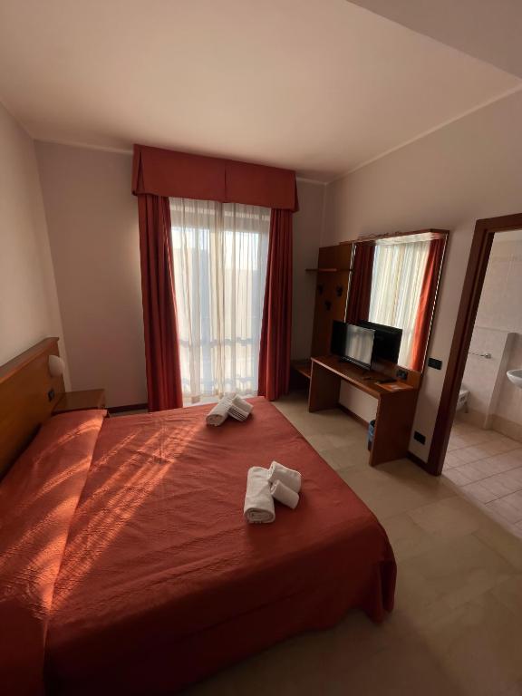 Postel nebo postele na pokoji v ubytování Aba Hotel