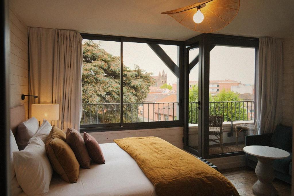 Postel nebo postele na pokoji v ubytování Boutique Hotel SOCLO