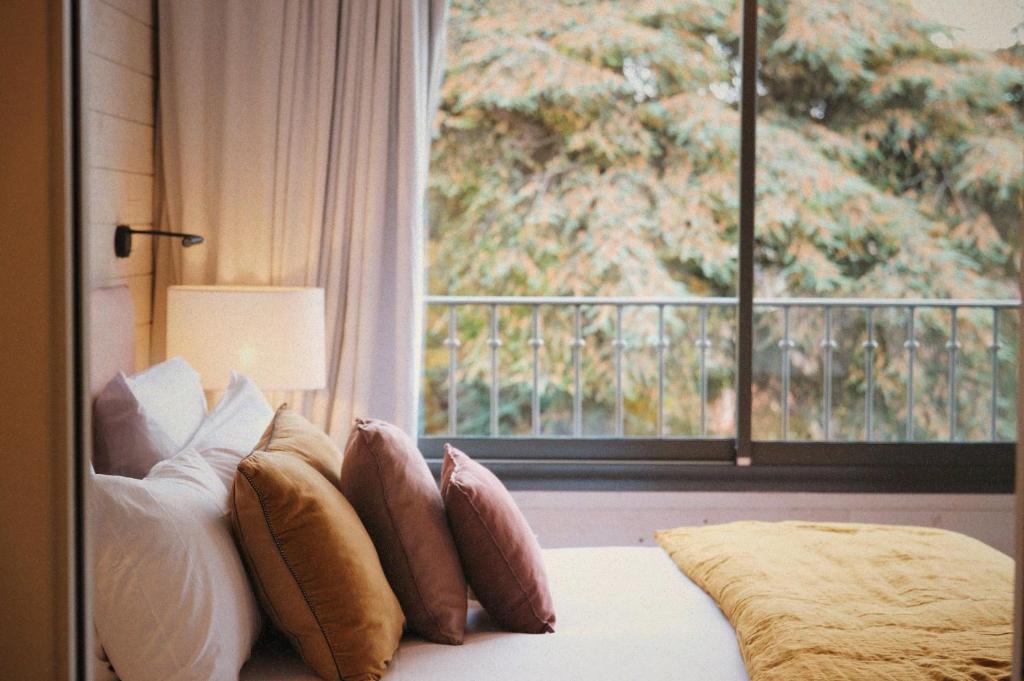 Postel nebo postele na pokoji v ubytování Boutique Hotel SOCLO