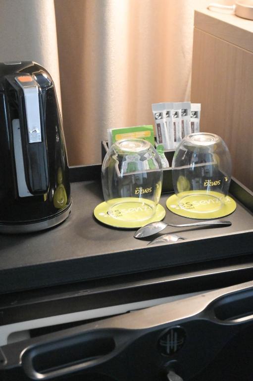 Kuchyň nebo kuchyňský kout v ubytování Hotel Essenza