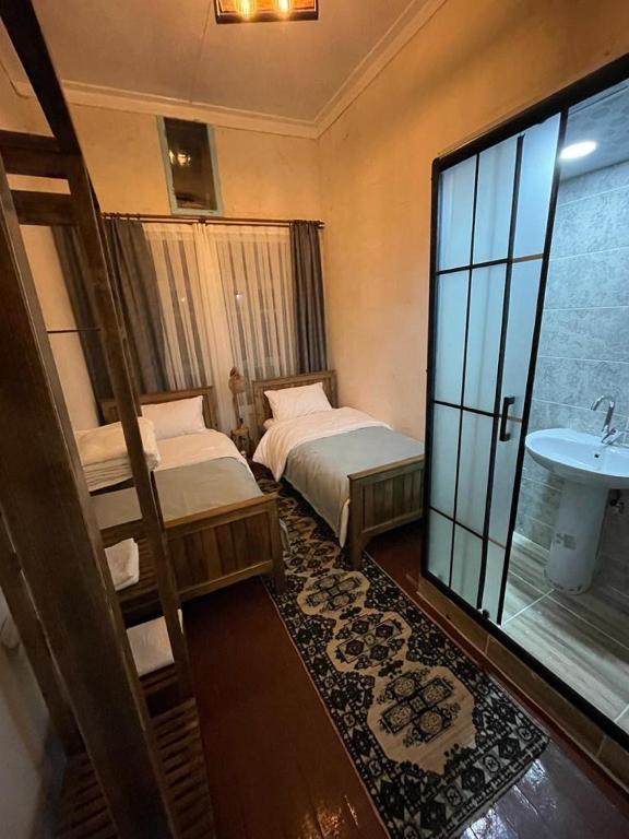 Postel nebo postele na pokoji v ubytování Sarmaşık Otel