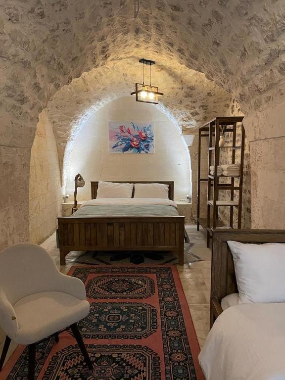 Postel nebo postele na pokoji v ubytování Sarmaşık Otel