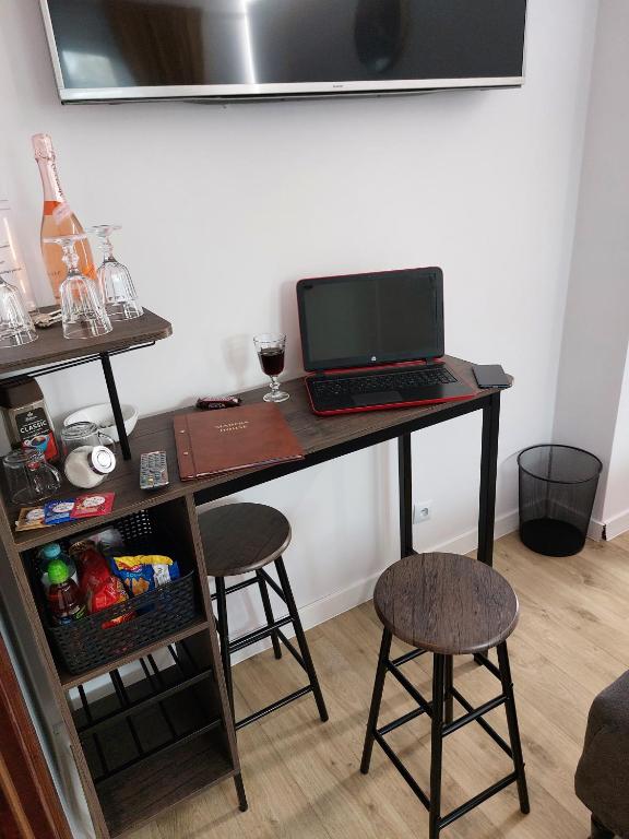 Televízia a/alebo spoločenská miestnosť v ubytovaní Madera House