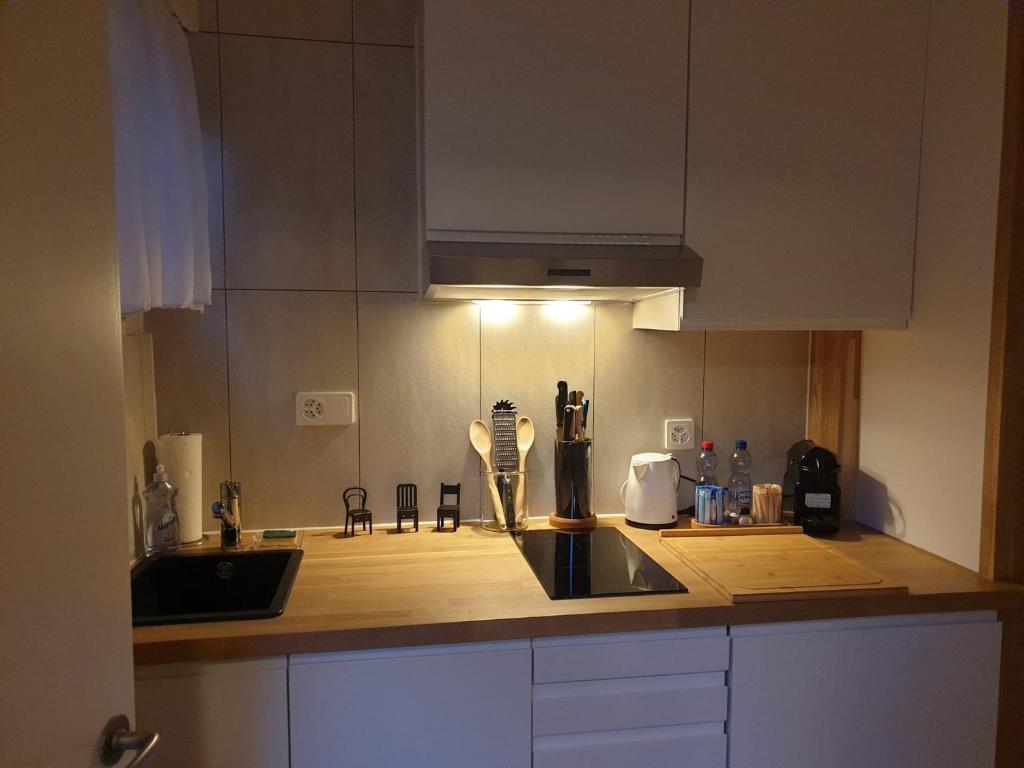 Kuchyň nebo kuchyňský kout v ubytování El Destino Apartments