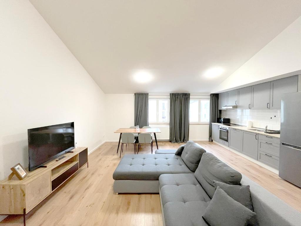 Kuchyň nebo kuchyňský kout v ubytování Cozy Atmos Apartments